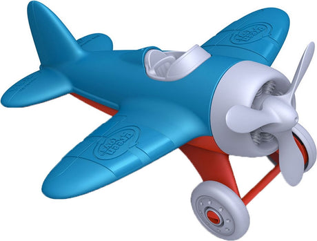 Grünes Spielzeugflugzeug - blau