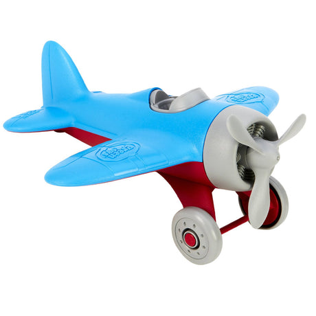 Grünes Spielzeugflugzeug - blau