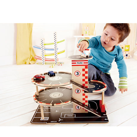 Hape Park Go Garage – Spielzeugparkhaus mit Aufzug, Helikopter und Autos, ab 3 Jahren
