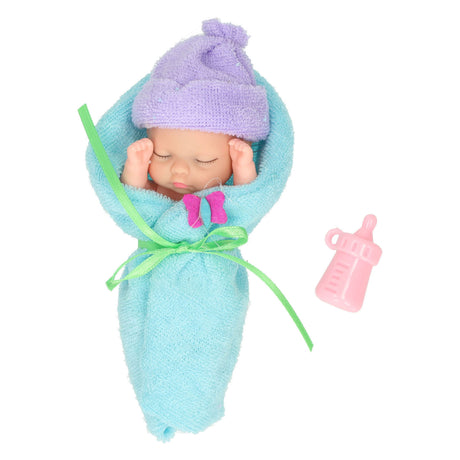 Minipuppe in Wickelstoff