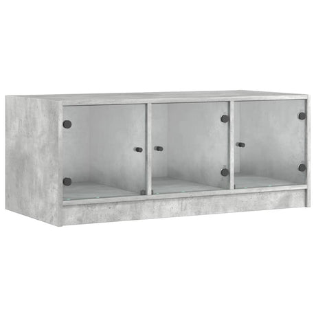 Vidaxl salontafel met glazen deuren 102x50x42 cm betongrijs