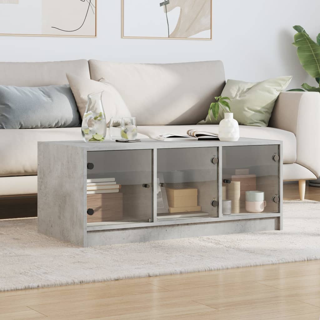 Vidaxl salontafel met glazen deuren 102x50x42 cm betongrijs