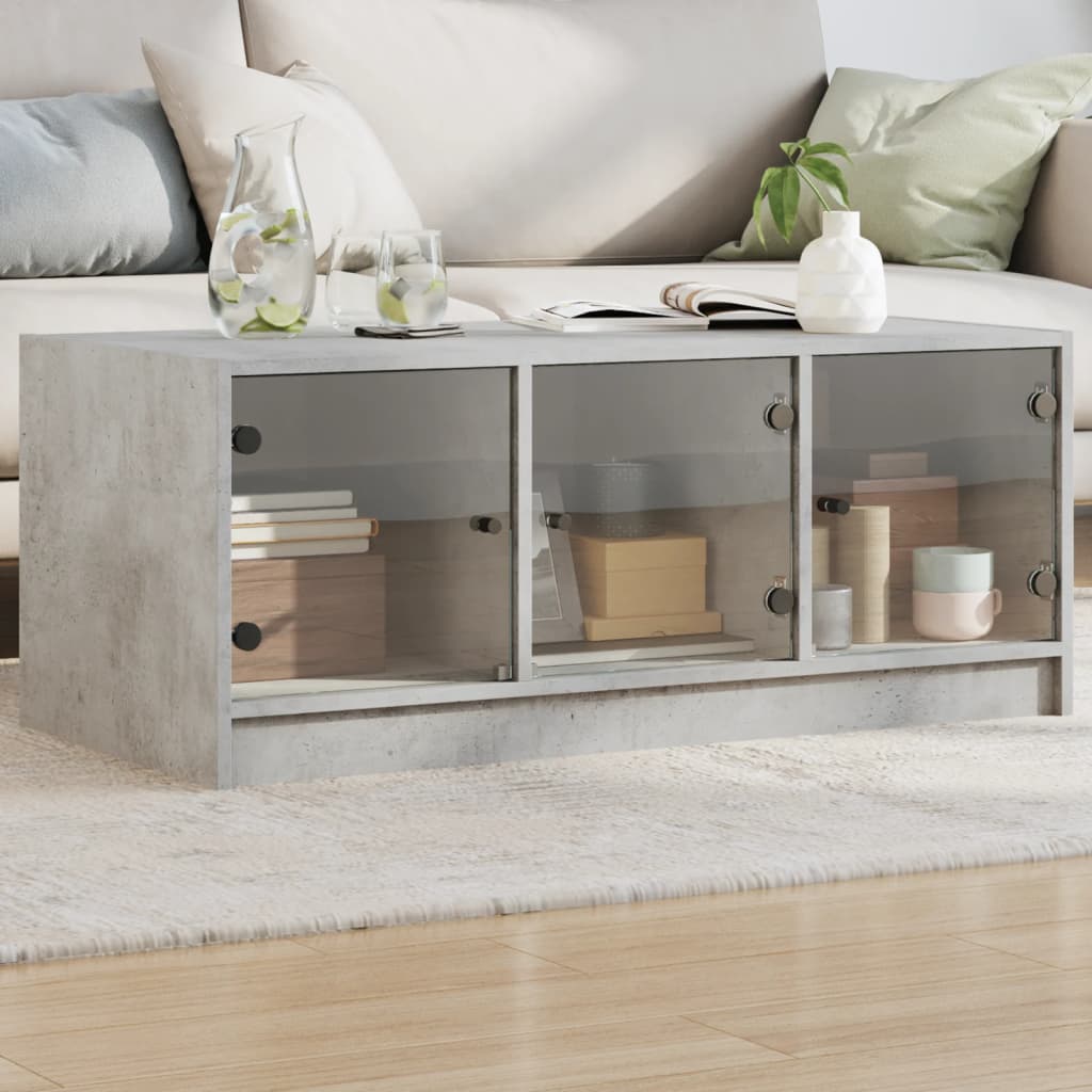 Vidaxl salontafel met glazen deuren 102x50x42 cm betongrijs