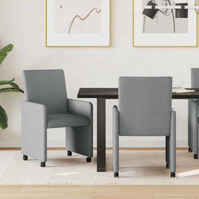 Vidaxl eetkamerstoelen met wieltjes 2 st stof lichtgrijs