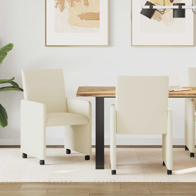 Vidaxl eetkamerstoelen met wieltjes 2 st kunstleer crème