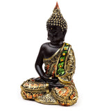 Schwarz-orange thailändische Buddha-Kontemplation
