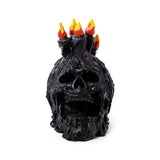 Schwarzer schreiender Totenkopf mit Wachskerzen
